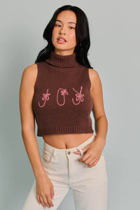 Sleeveless brown turtleneck cropped top featuring JOY embroidery in pink