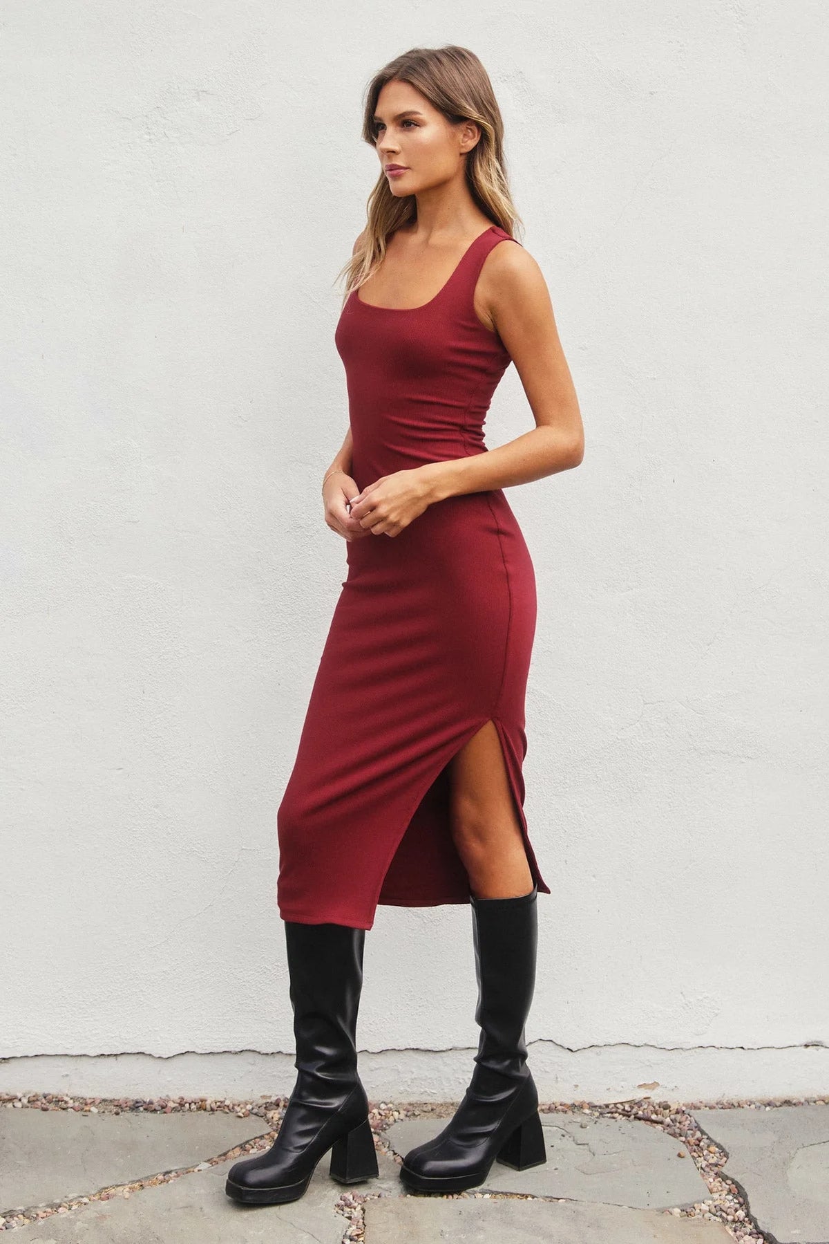 Sleeveless burgundy ribbed knit square neck midi dress with side slit and black boots