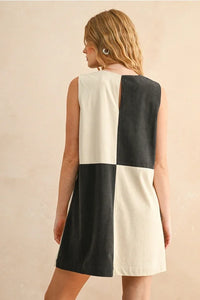 Corduroy color block mini dress featuring a sleeveless checkerboard pattern in black and off-white