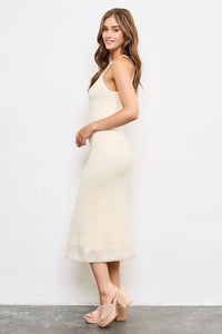 Sleeveless cream maxi knit dress with a fitted silhouette perfect for elegant occasions