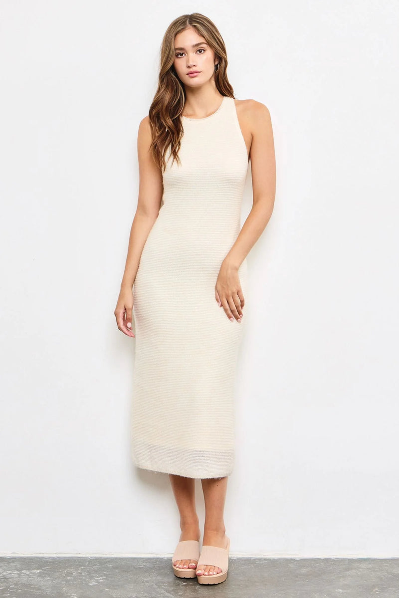 Sleeveless cream-colored maxi knit dress featuring a fitted silhouette