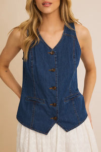 Sleeveless denim vest with brown buttons and pockets from Shop Daisy for women’s boho chic clothing