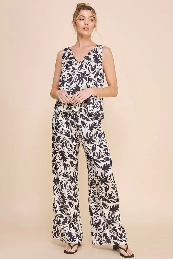 Sleeveless jumpsuit with black and white floral pattern in Printed Satin High Waisted Wide Leg Pants