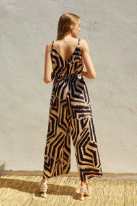 Sleeveless OFF LIMITS CORD STRAP SURPLICE JUMPSUIT with bold geometric print in neutral tones