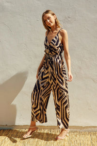 Sleeveless OFF LIMITS CORD STRAP SURPLICE JUMPSUIT with bold zebra-like print pattern