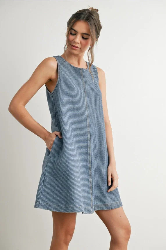 Light blue and white striped sleeveless denim mini dress with pockets for stylish wear