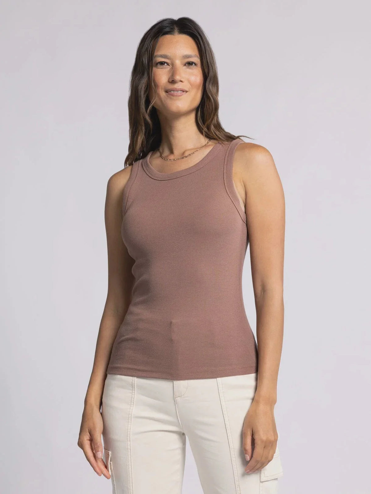 Sleeveless mauve tank top worn by a woman showcasing the Edlin Basic Tank