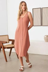 Sleeveless peach midi dress with scoop neckline for a flowy boho free spirit style