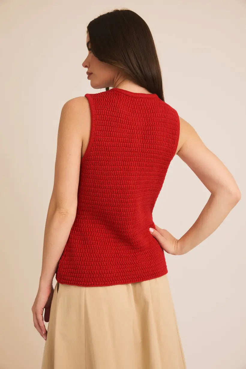 Sleeveless red knitted sweater vest for women, showcasing boho chic style from behind