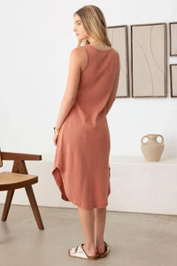 Sleeveless terracotta midi dress with high-low hemline, perfect for the boho free spirit