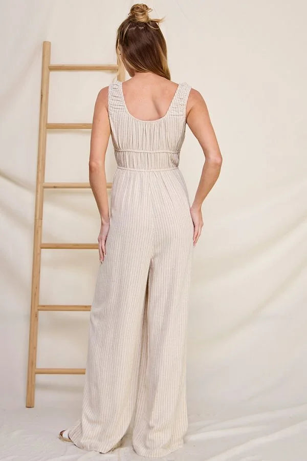 Sleeveless white MILKMAID PINSTRIPE LINEN BLEND JUMPSUIT with wide-leg pants and fitted waist