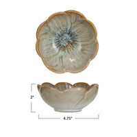 Stoneware flower shaped bowl with decorative flower design on the bottom