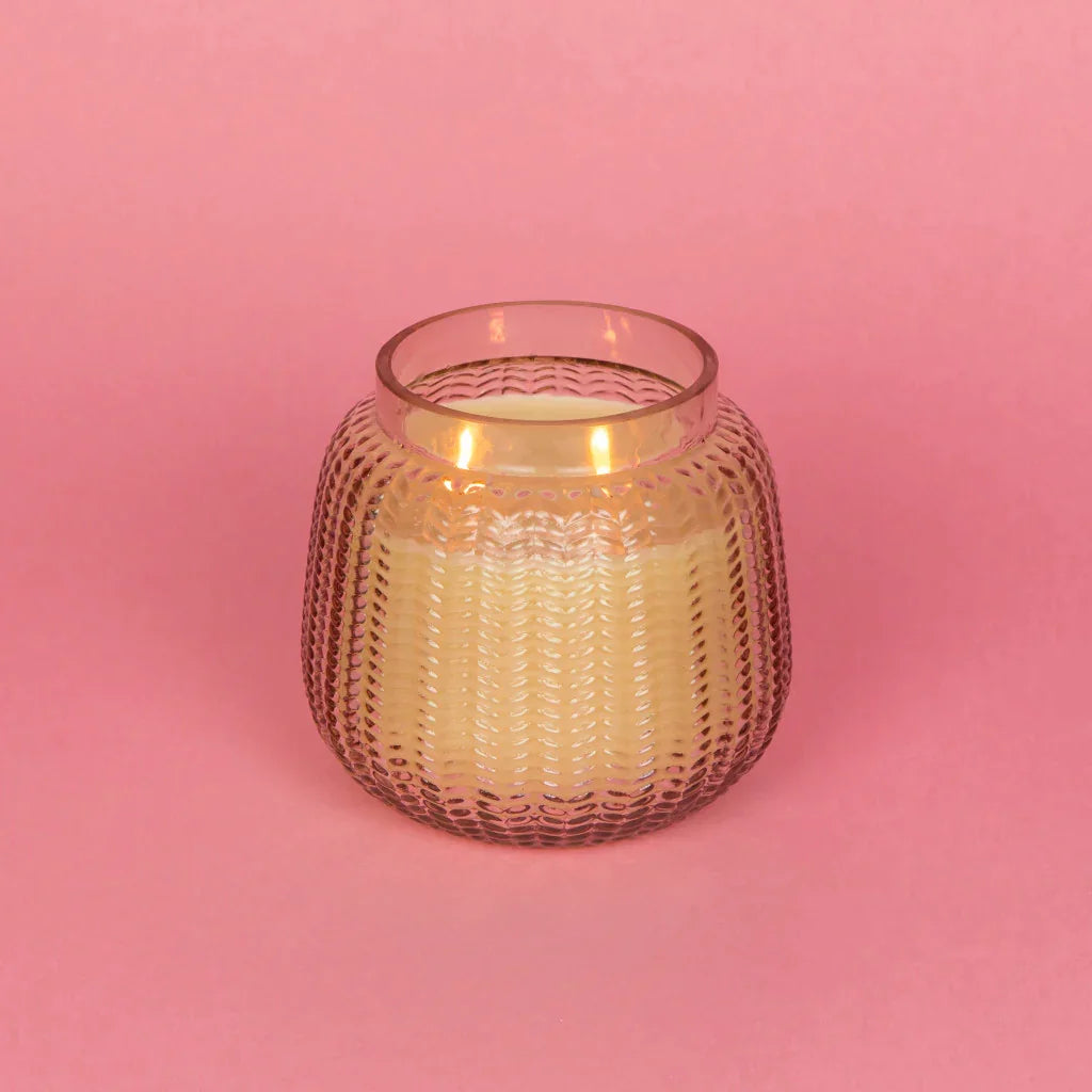 Small glass candle on pink background, Sweet Grace Candle in Passion Fruit & Patchouli