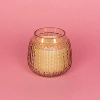 Small glass candle on pink background, Sweet Grace Candle in Passion Fruit & Patchouli