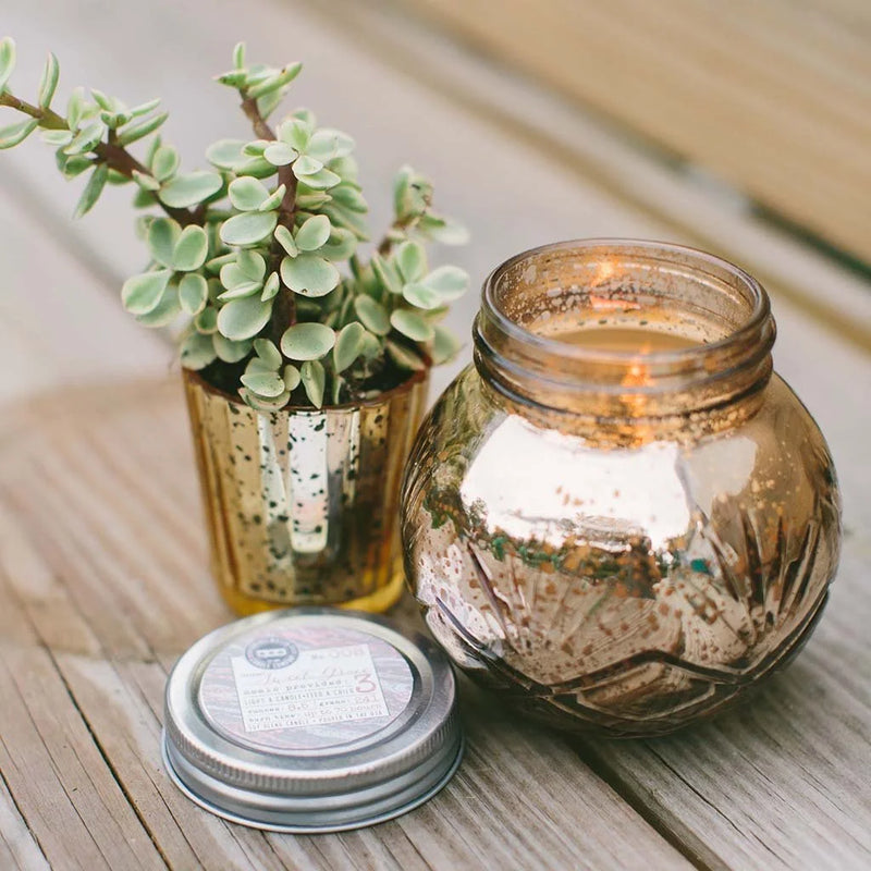 Small jar with a Soy-Blend Sweet Grace Candle and decorative plants. Best-selling fragrance