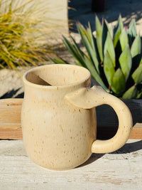 16 OZ Stoneware Mug with Whale Tail Handle on a Wooden Table for Stylish Enjoyment