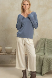 Soft dusty blue V-neck long sleeve sweater top with relaxed fit