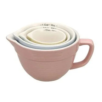 Stack of three Stoneware Measuring Cups including a white and pink cup