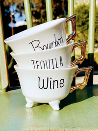 Stack of three Stoneware Footed Teacups with gold electroplating handles and labels