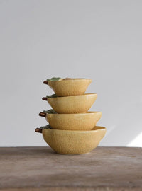 Yellow bowls on wooden table, showcasing Lemon Measuring Cups for precise measuring