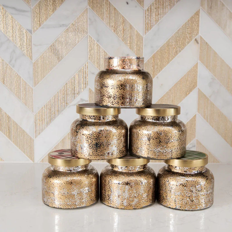 Sweet Grace Mercury Jar Candle 18oz in stacked gold glass jars