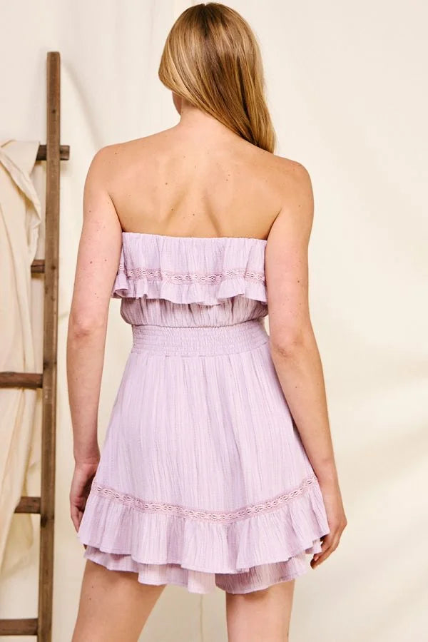 Back view of Bamboo Textured Strapless Ruffle Romper in elegant lavender with ruffles