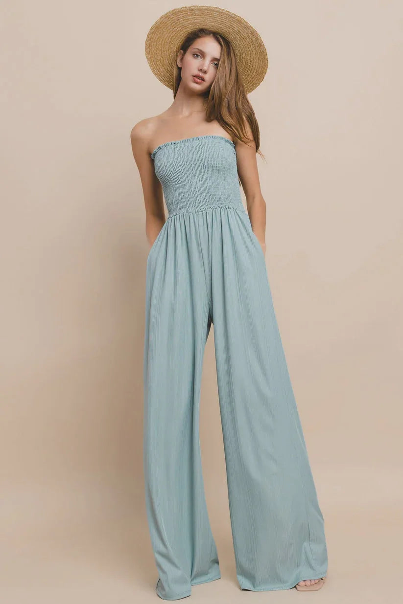 Strapless ribbed knit smocked tube jumpsuit with wide-leg pants and a fitted bodice