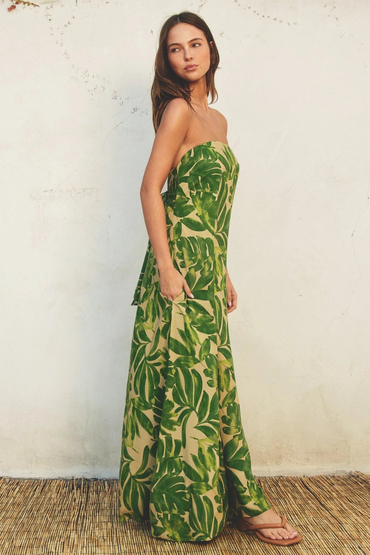 Strapless maxi dress with green tropical leaf print, perfect for a boho flowy style