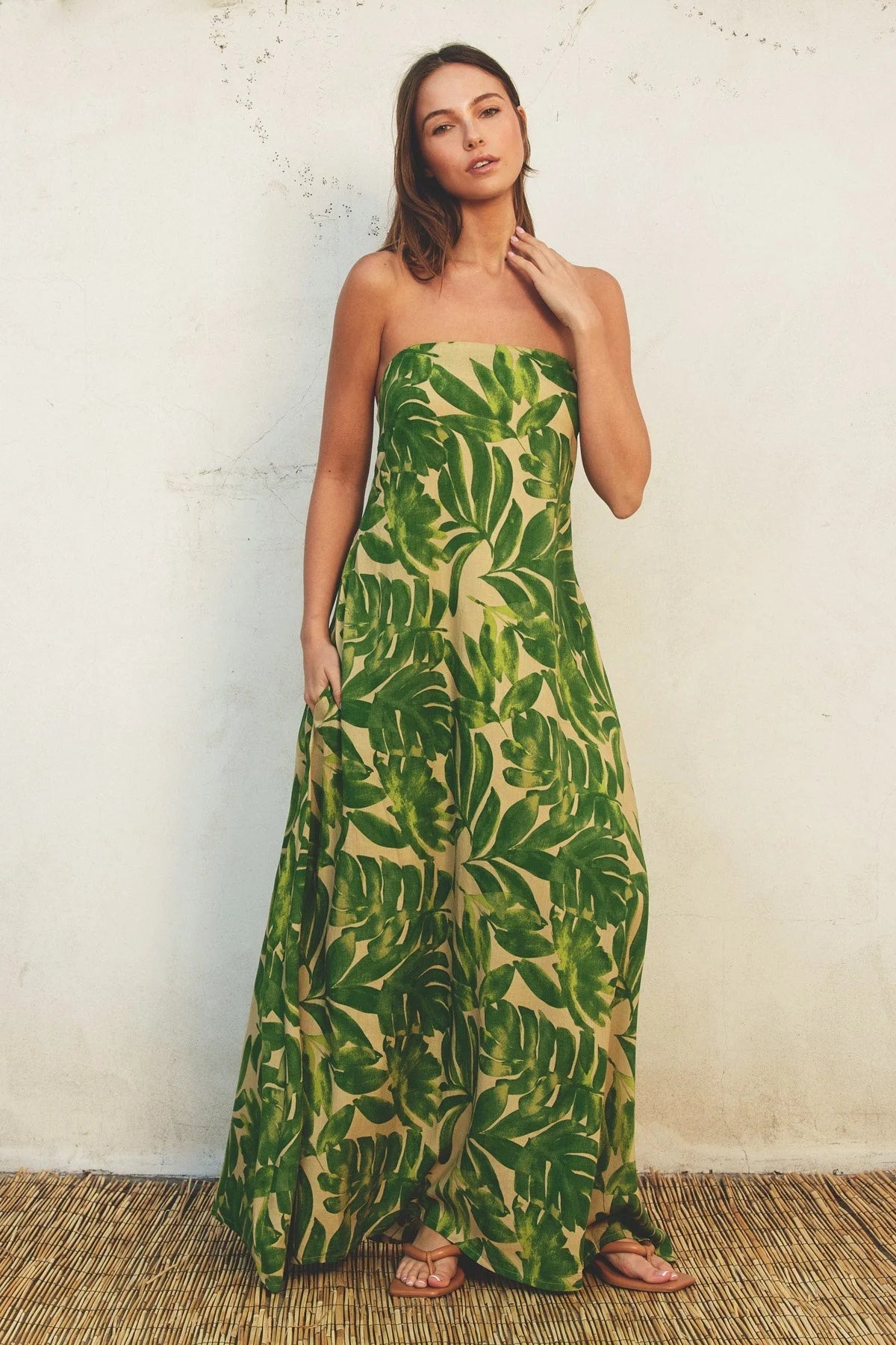 Strapless maxi dress with vibrant green tropical leaf print for a boho chic look