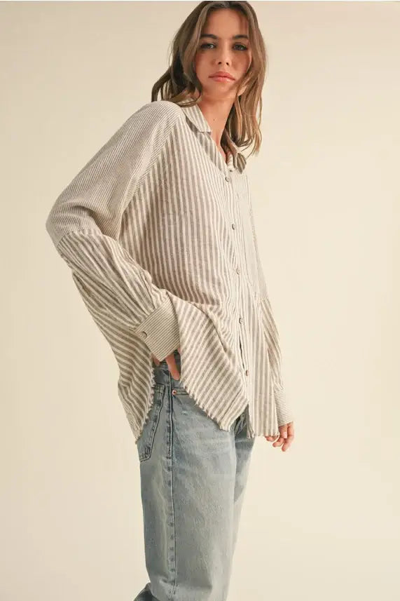 Striped button-down shirt with jeans showcasing the multi stripe pattern design