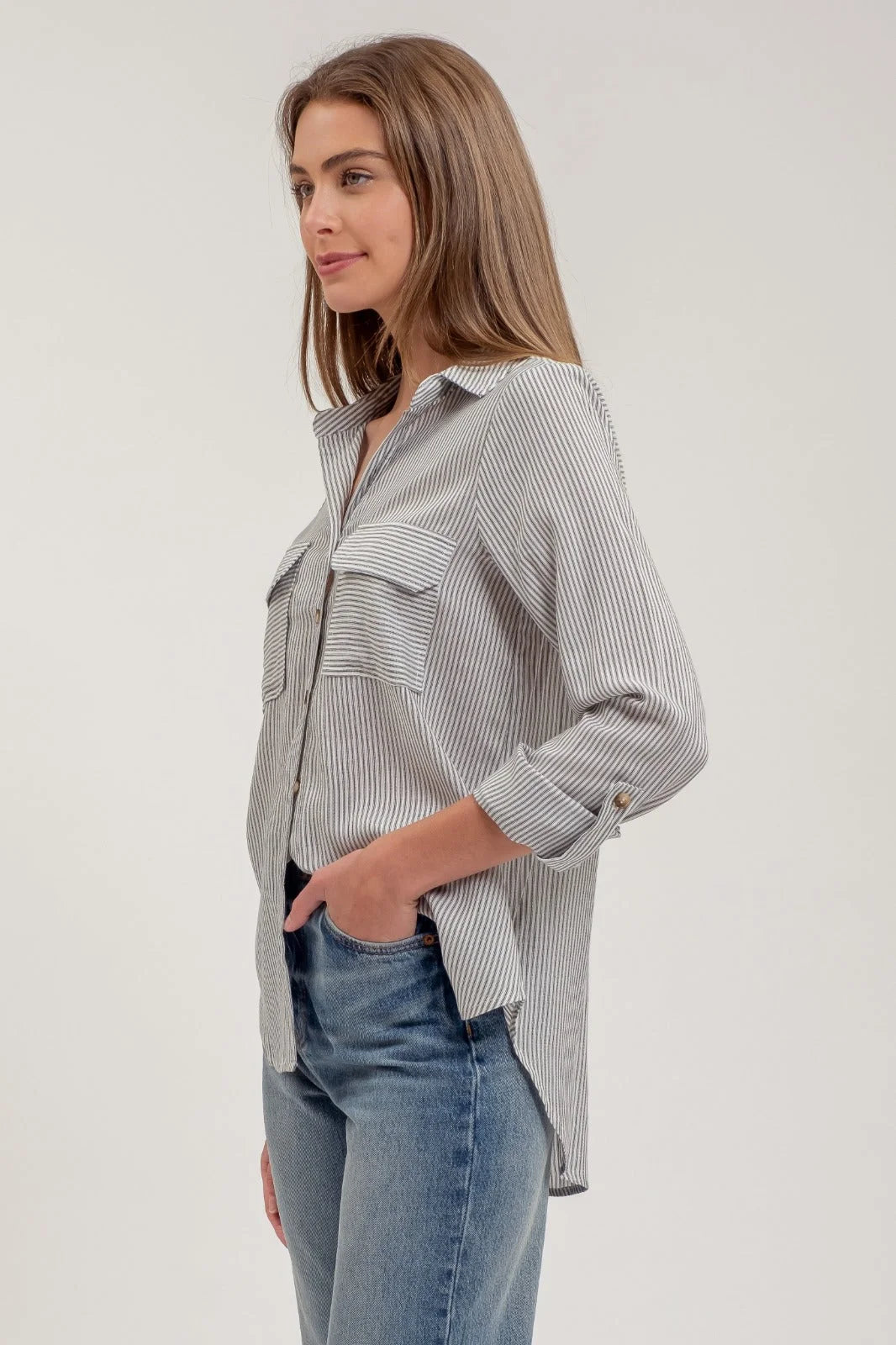 Striped collared button-up shirt with long sleeves and chest pockets for stylish attire