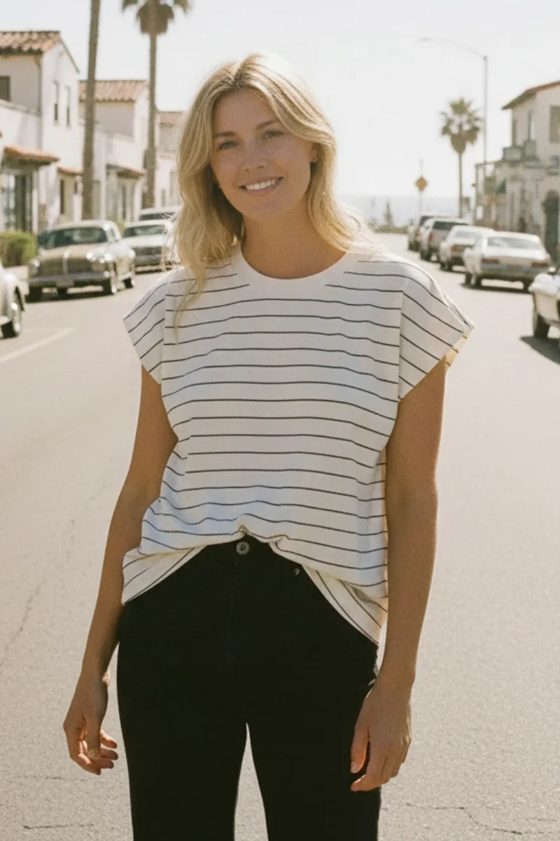 Striped cotton Bella Tee with rolled sleeves and black pants
