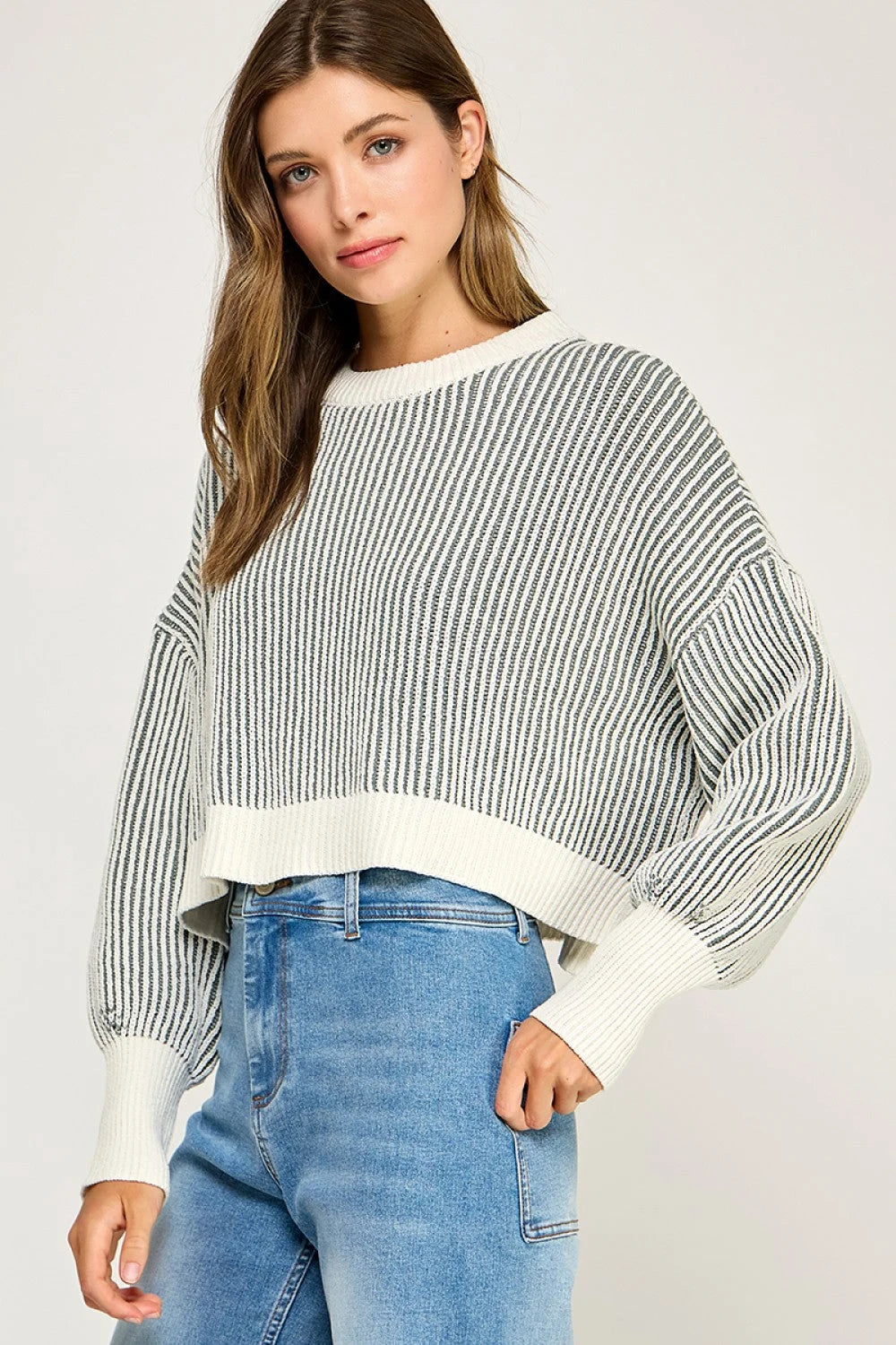 Ribbed knit balloon sleeve sweater with striped dolman sleeves and white cuffs