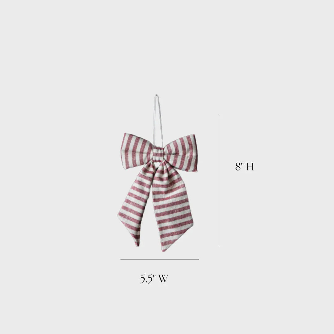 Striped cranberry red fabric bow ornament in pink and white, on silver hook