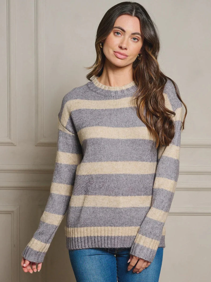 Striped gray and cream knit sweater showcasing women’s boho chic clothing from Shop Daisy