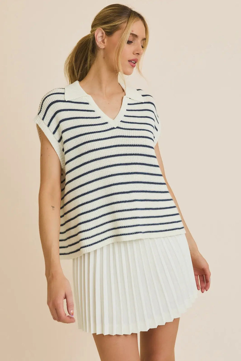 Striped knit Wide Shoulder V Neck Stripe Sweater styled with a pleated skirt