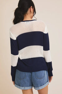 Lightweight striped sweater featuring round neck long sleeve design for beach outings