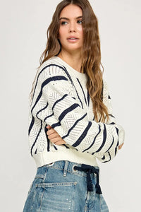 Knit sweater featuring stripes, perfect for women’s boho chic clothing at Shop Daisy