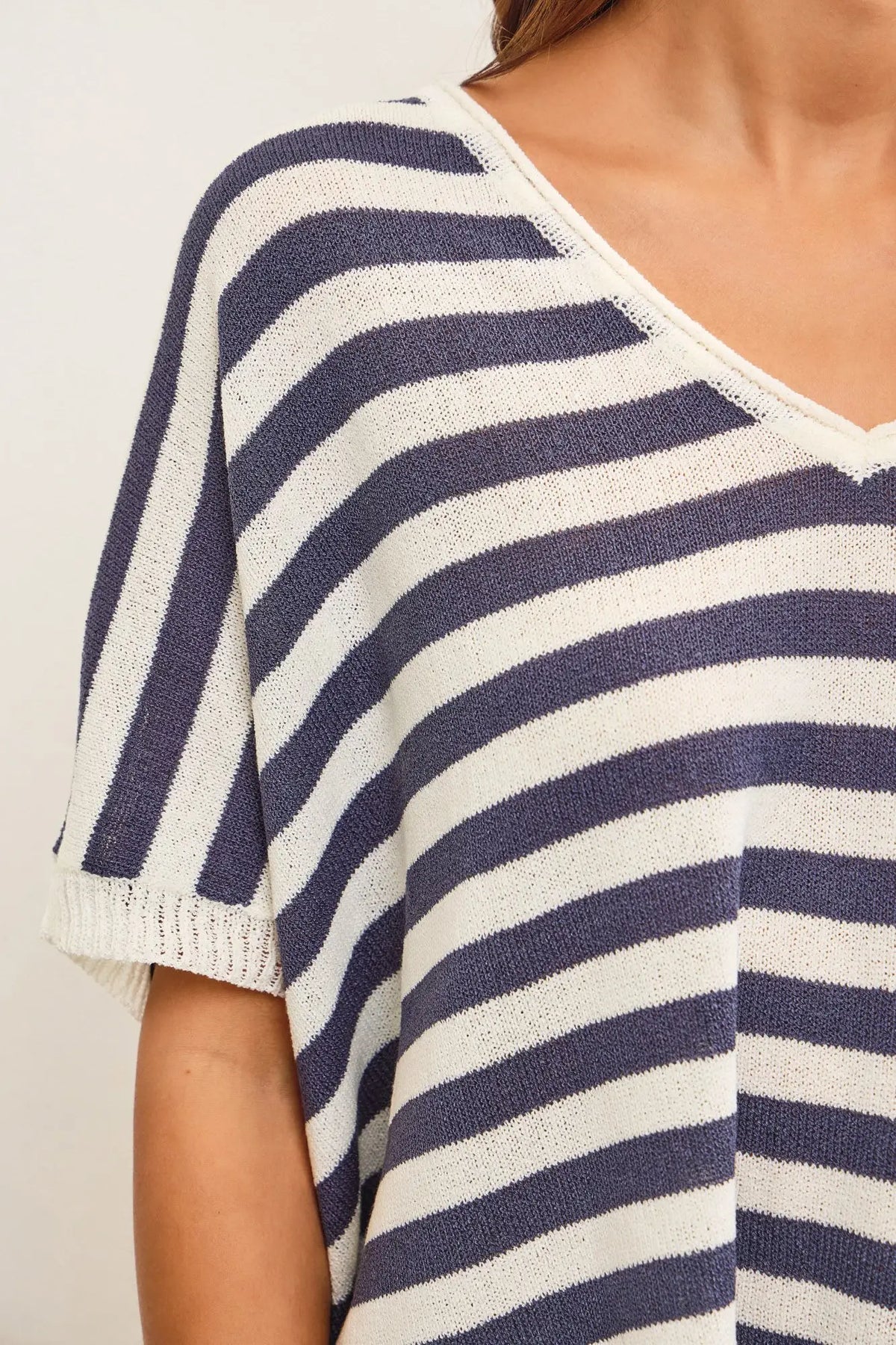 V-neck oversized stripe sweater top featuring a stylish striped knit design