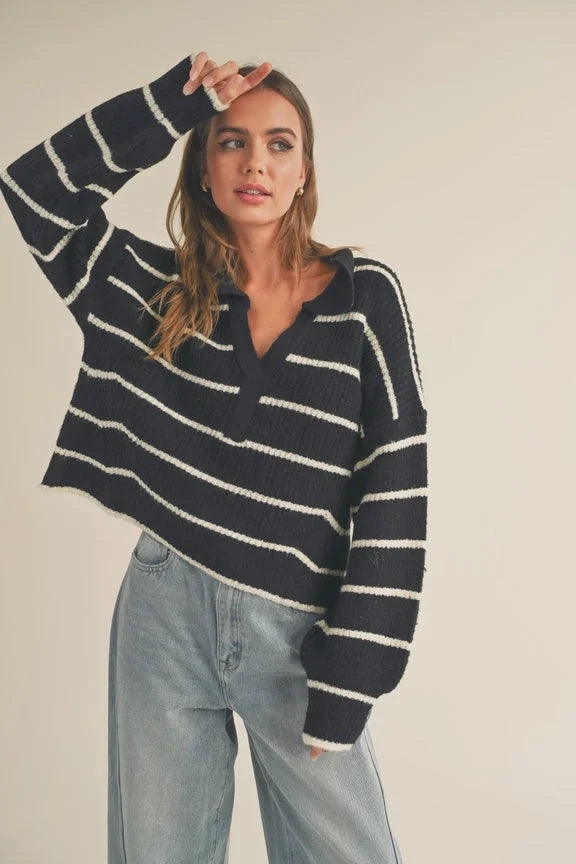 Striped pattern collar sweater demonstrating a navy and white oversized design with v-neck