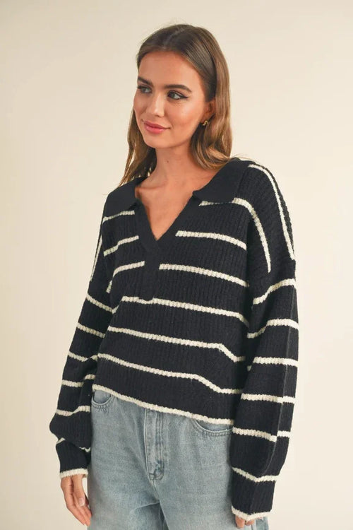 Striped navy and white v-neck sweater with long sleeves and pattern collar detail