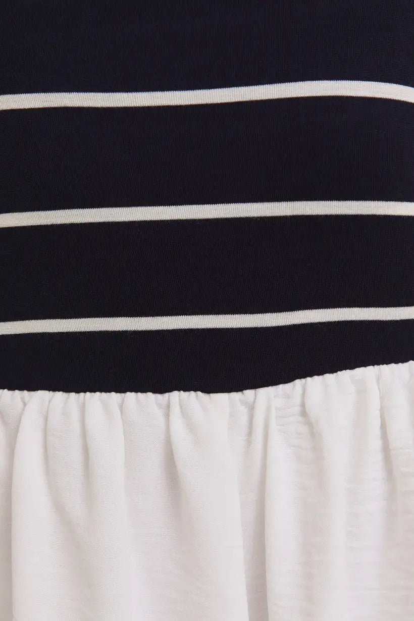 Striped navy and white fabric with gathered white material on woven shorts mix romper