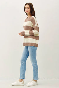 Striped Cable Knit Crew Neck Sweater in beige and white paired with blue jeans and sneakers