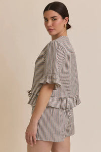 Striped pajama set featuring a front tie short sleeve blouse with ruffle hem stripe detail