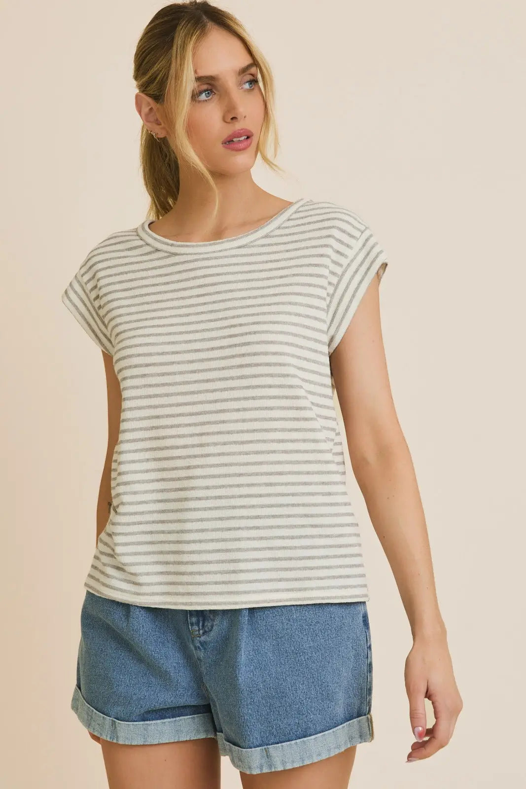 Round neck short sleeve stripe top featuring a stylish striped pattern and casual fit