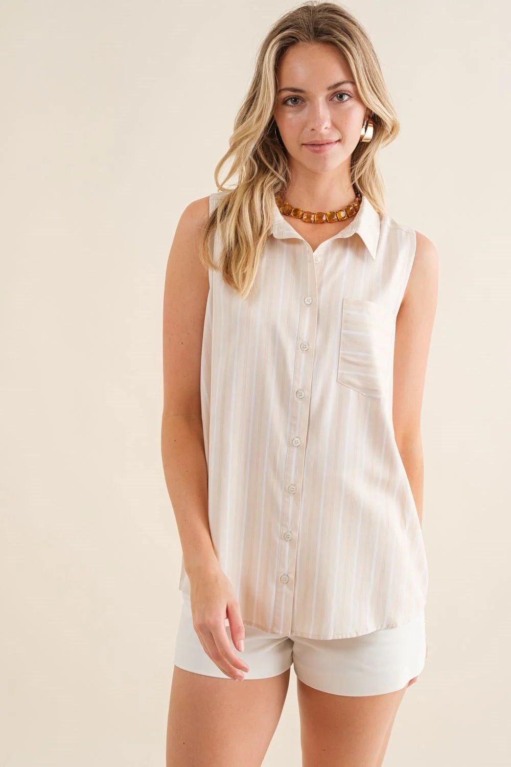 Striped sleeveless collar top showcasing a chic and stylish design for any occasion