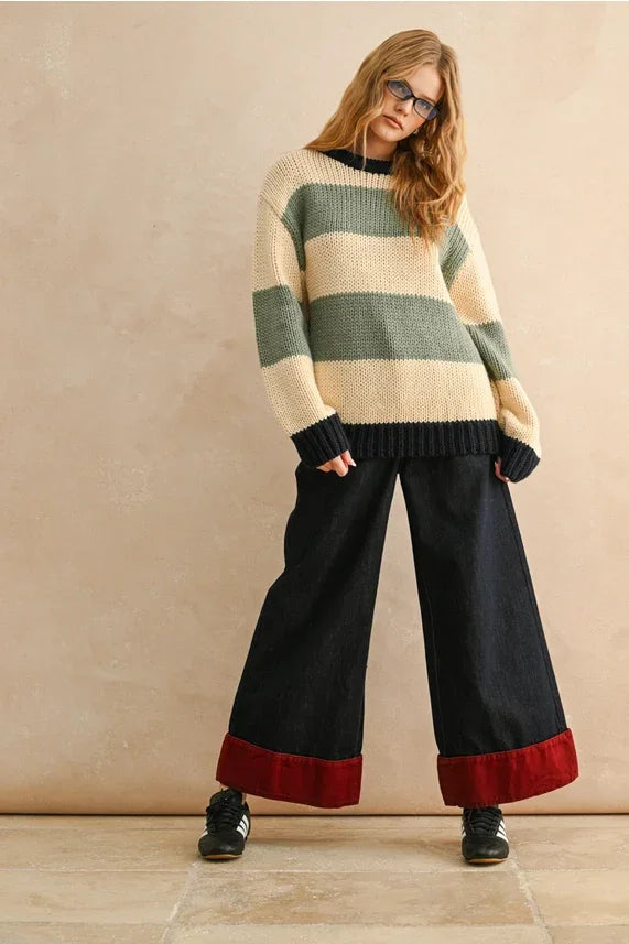 Striped sweater with textured knit in black, green, and cream for wide leg contrasted cuffed pants