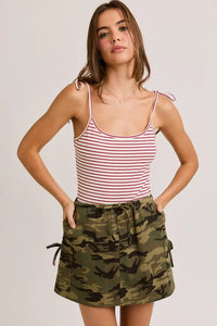 Women’s boho chic clothing featuring shoulder tie straps with striped tank top and camouflage skirt