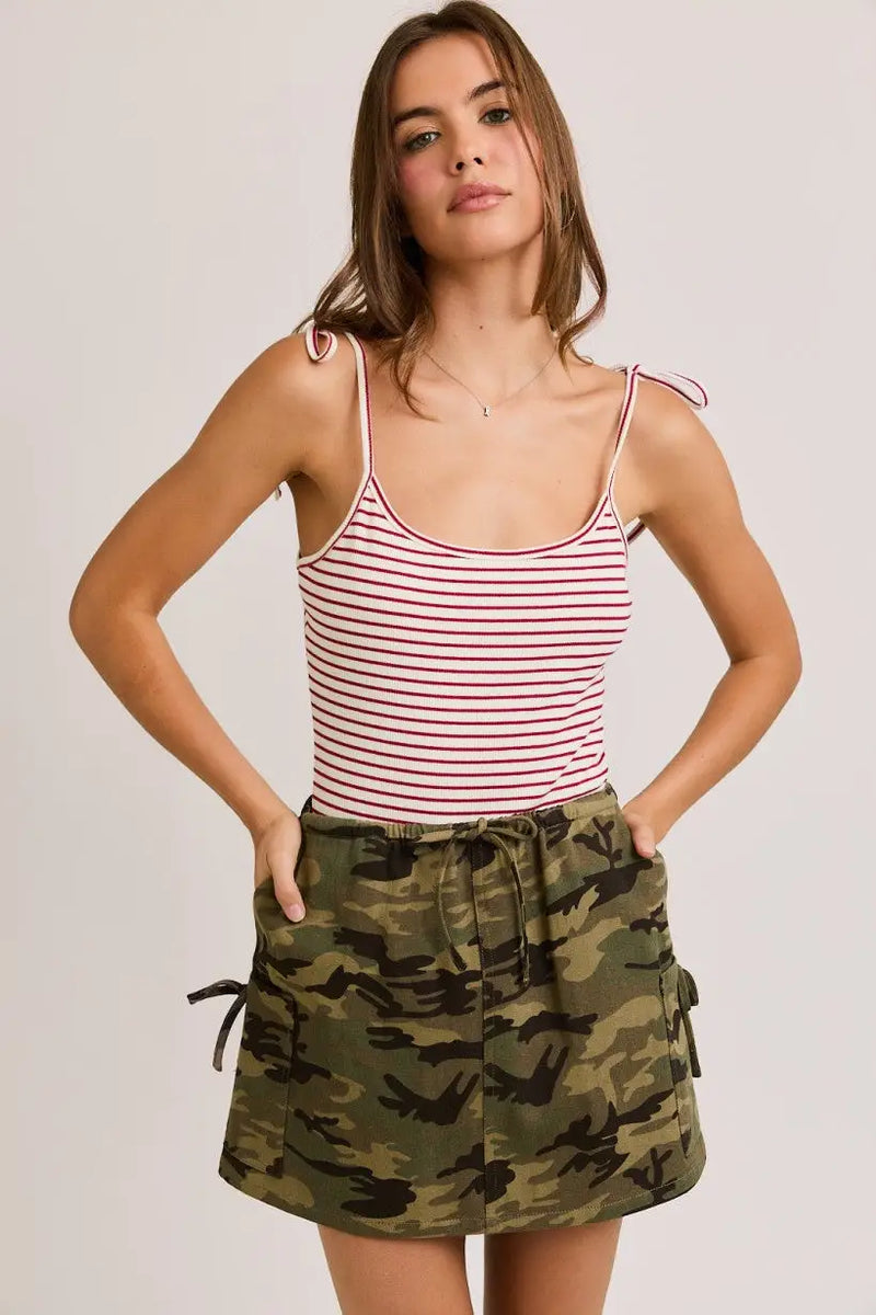 Women’s boho chic clothing featuring shoulder tie straps with striped tank top and camouflage skirt