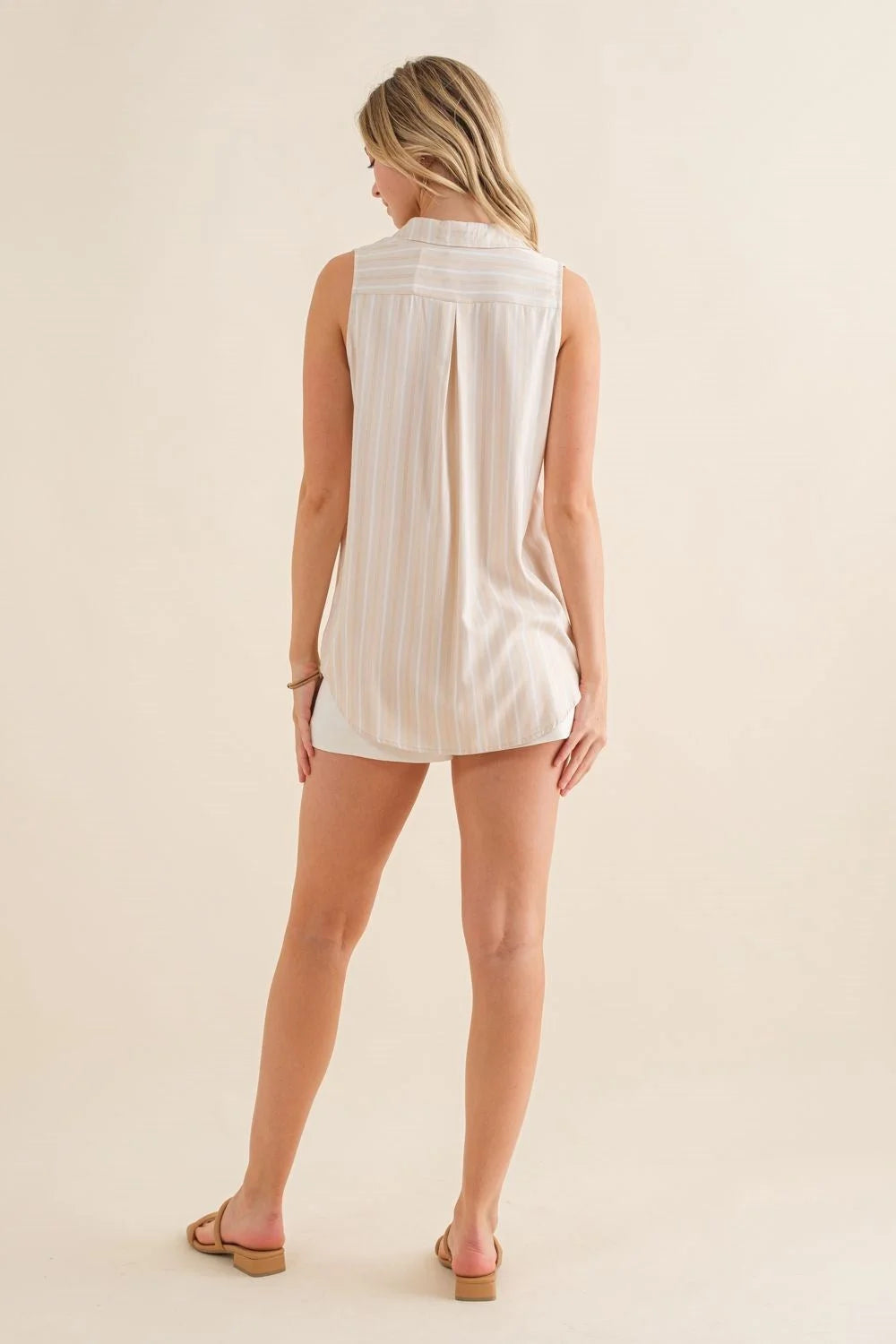 White Striped Sleeveless Collar Top showcasing a stylish striped sleeveless design